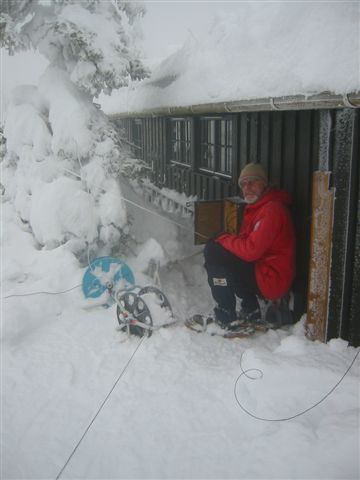 Tore checking his antennas at his cabin in the mountains, 30 kilometers north of Hamar, 800 meters above sea level, during a February 2003 venture.